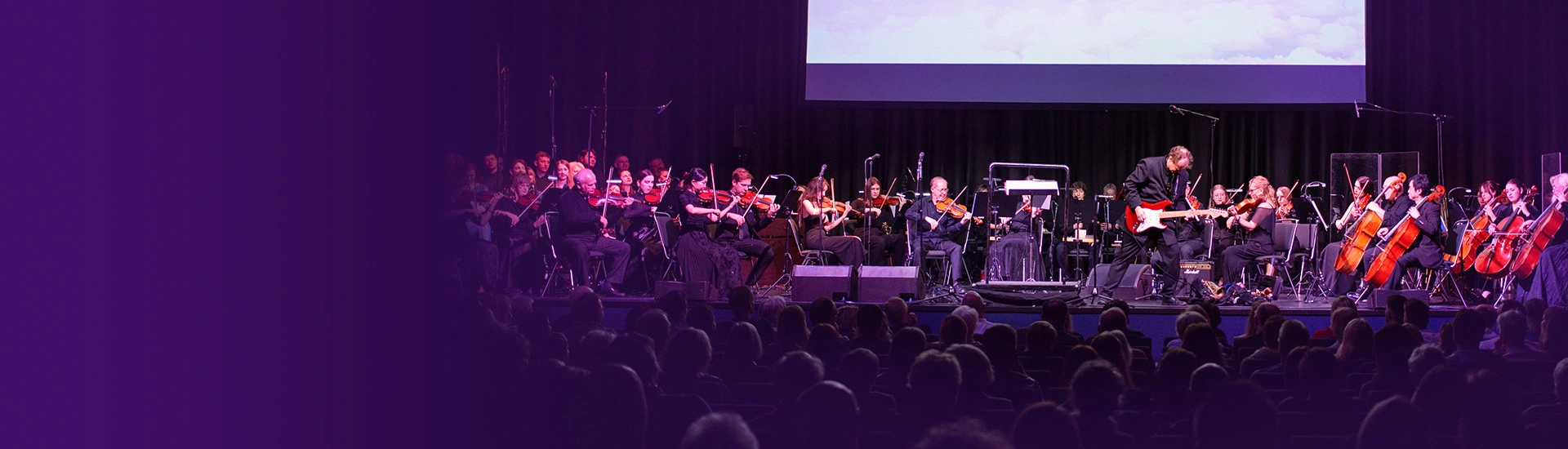 Teaserbild zu The Magic of Hans Zimmer mit Orchester und Musiker auf der Bühne